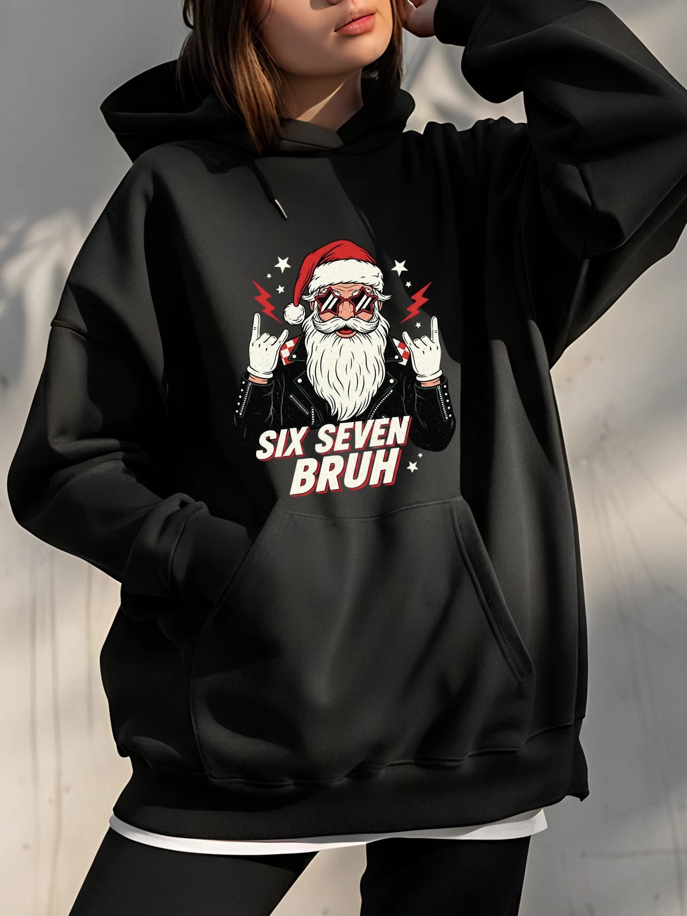 Six Seven Bruh Santa hoodie with rock gesture print and star details for casual clothing in urban settings