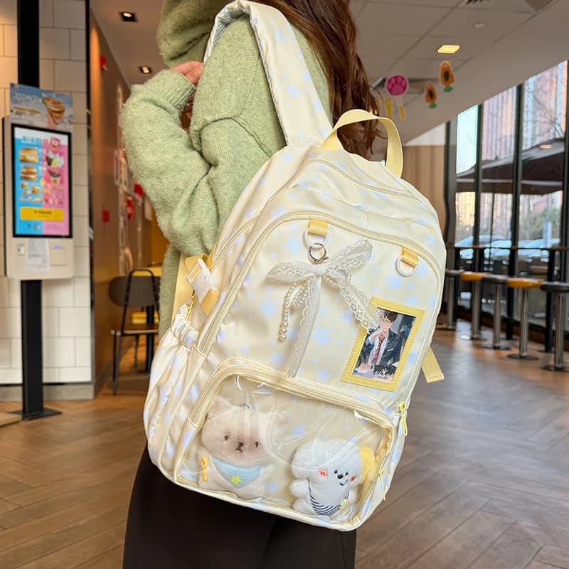 Zaino da donna con stampa a stelle, tasche trasparenti, ciondolo a fiocco in pizzo, tracolla regolabile, borsa casual quotidiana Itabag, borsa scolastica 2026