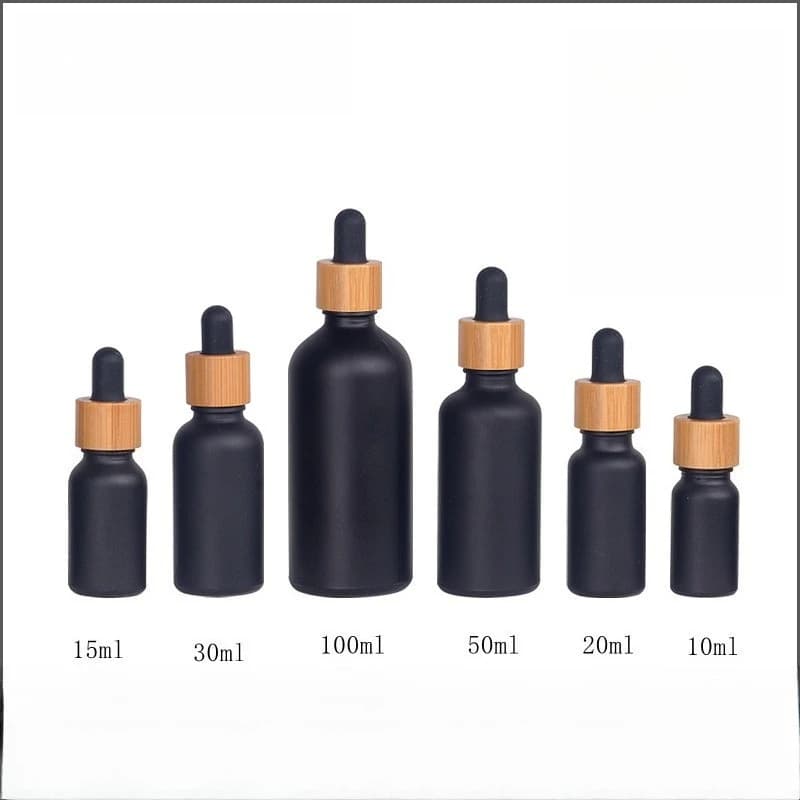 2/5/10pcs 5/10/15/20/30/50/100ml Bottiglia di olio essenziale nero opaco Tappo contagocce in gomma di legno di bambù Bottiglia cosmetica in vetro smerigliato