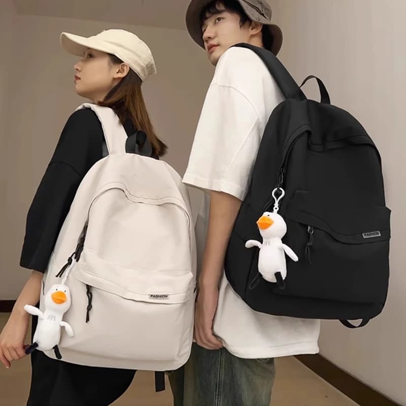 Zaino casual in stile coreano per uomo e donna, borsa leggera per la scuola, i viaggi e l'uso quotidiano, con grazioso ciondolo a forma di anatra, spedizione gratuita