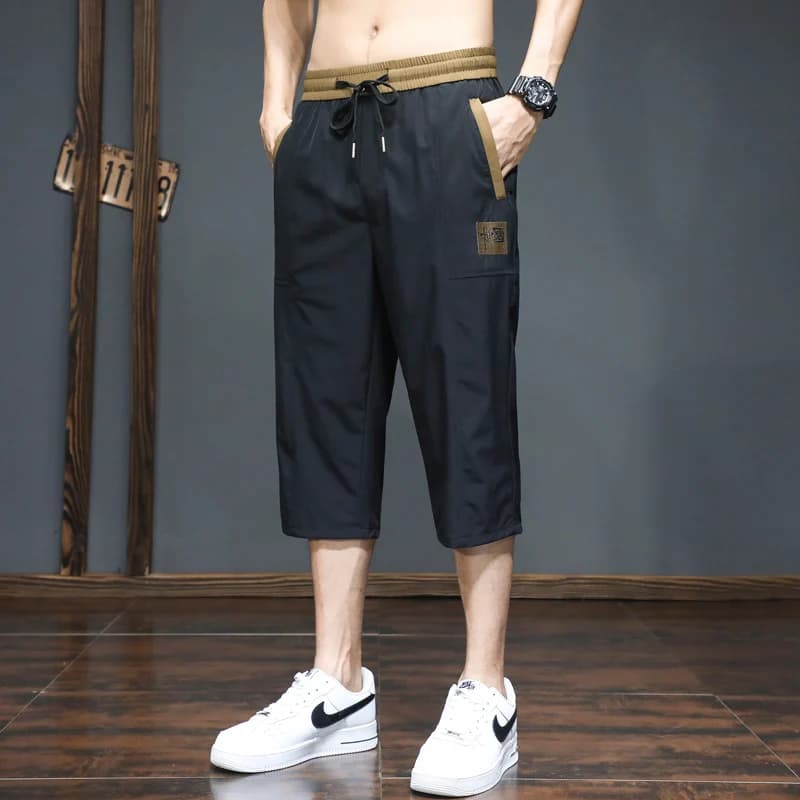 Pantaloncini da uomo estivi per sport all'aperto, assorbenti, ad asciugatura rapida, da sette pollici, alla moda, trendy, larghi e traspiranti