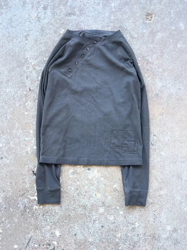Solid color casual round neck long sleeve T-shirt diagonal buckle design fits unisex 2026 spring and autumn new style.