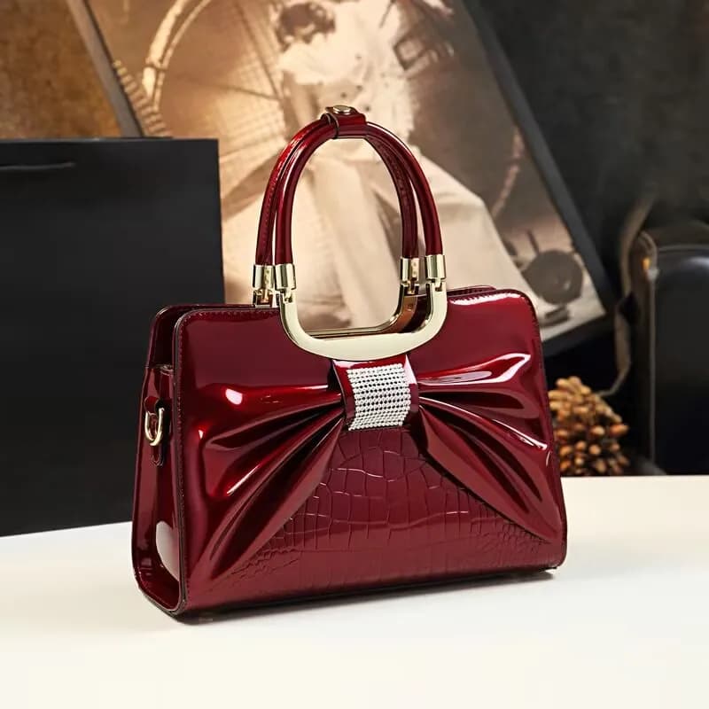 2024 Borse da sera in pelle lucida di design di lusso da donna Borsa a tracolla casual con tracolla da donna Borsa con papillon con diamanti alla moda