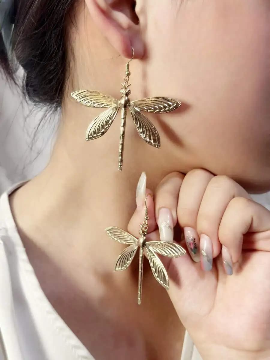 Fashionable oversized dragonfly-shaped earrings for bold statement look