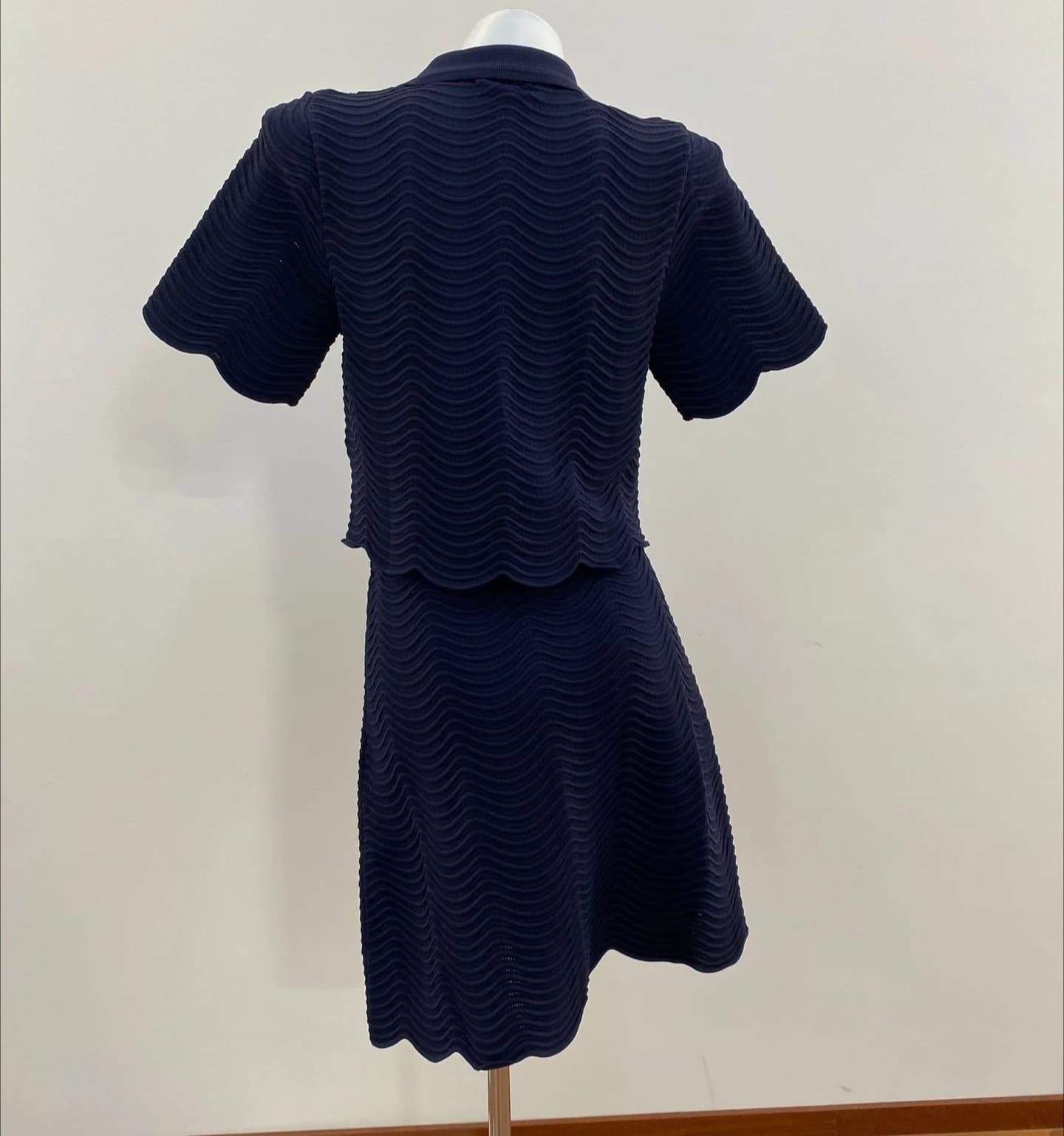 Women's dark blue knitted two-piece suit with short-sleeved cardigan or slim skirt