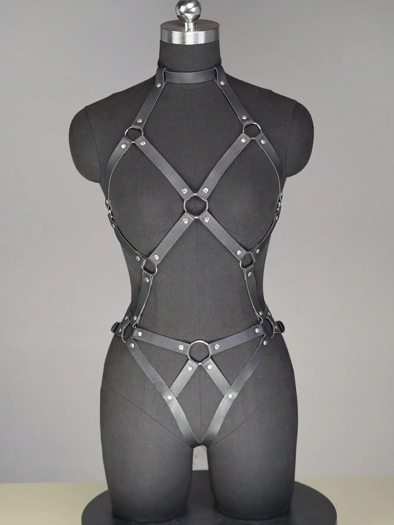 Full body in black leather with ring details