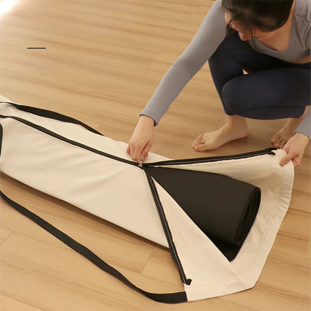 Canvas yoga mat transport bag with adjustable shoulder strap, wide zipper and closure with drawstring for all standard mats