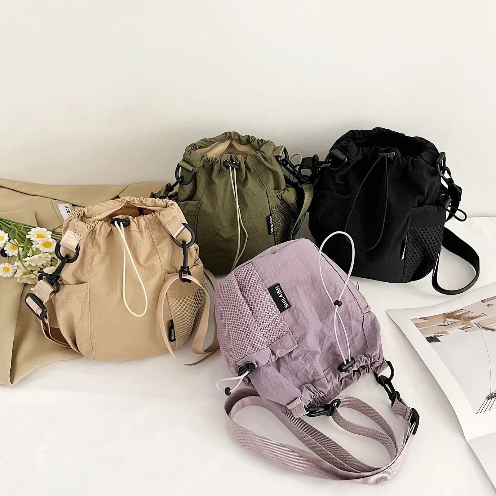 Borsa a tracolla in nylon con coulisse da donna, leggera, impermeabile, a secchiello, con tracolla regolabile, alla moda, per telefono