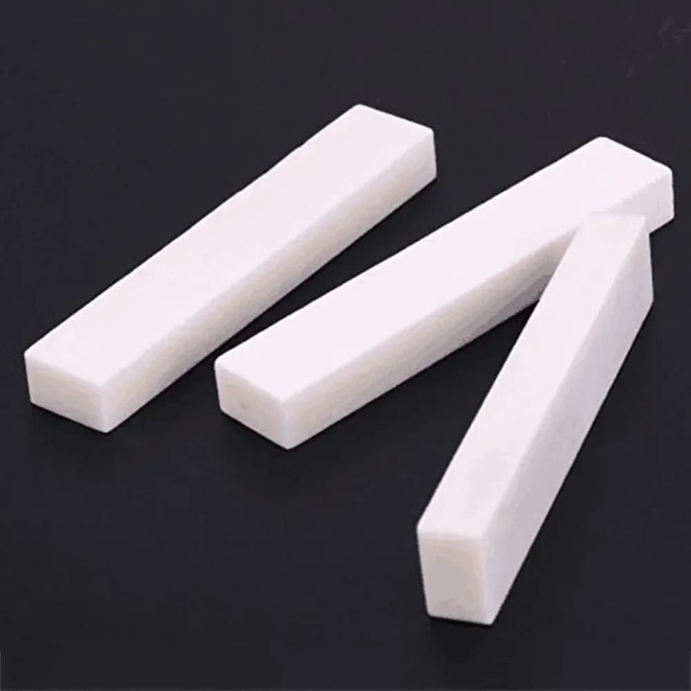 Dado per chitarra in bianco Osso di bufalo 52x10x6mm per basso elettrico classico acustico Ukulele Parti di strumenti a corda FAI DA TE