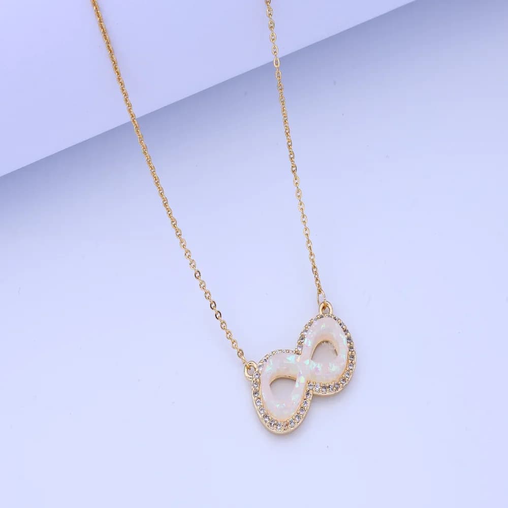 Beautiful necklace: set of pendants with infinity symbol with synthetic zircons, multicolor design, light luxury style, thin gold chain