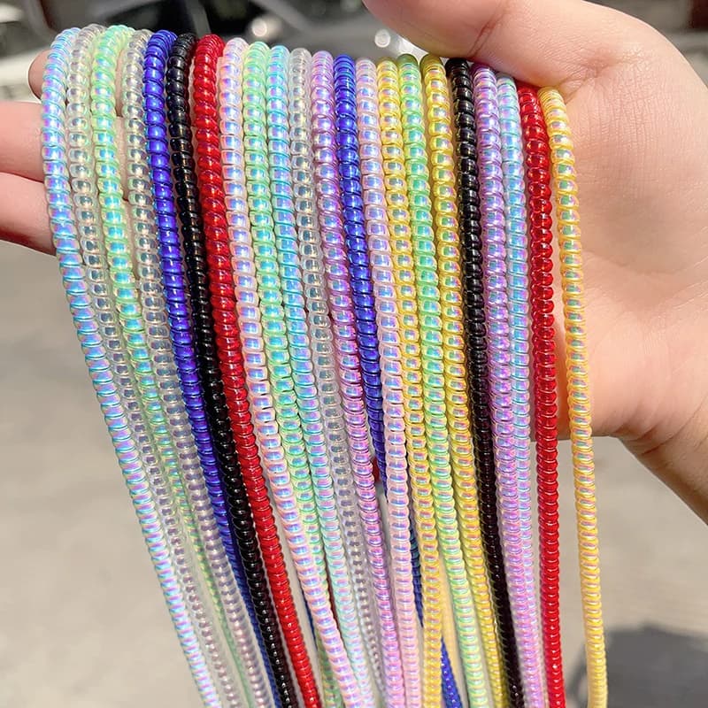 Protezione per cavo di ricarica USB a spirale in TPU da 1,4 M per iPhone 16 Samsung Huawei Placcatura a colori Cavo di protezione per auricolari Avvolgitore