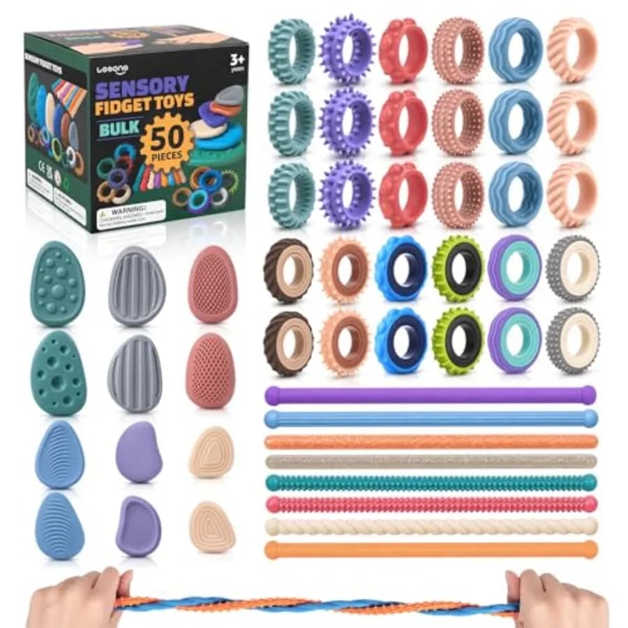 Quality Assurance 50 Pack Sensory Fidget Set Bulk - Worry Stones, Sensory Ring, Finger Spinner Rings, Stretchy Noodles for Stre
