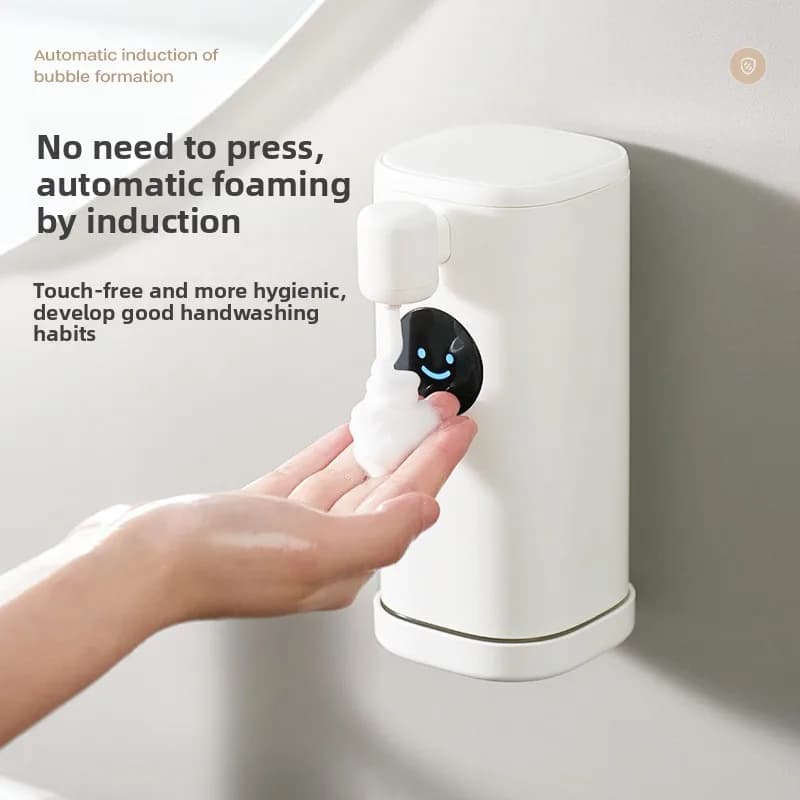 Nuovo sorriso automatico disinfettante per le mani Dispenser di sapone elettrico con sensore intelligente a parete per bambini con schiuma