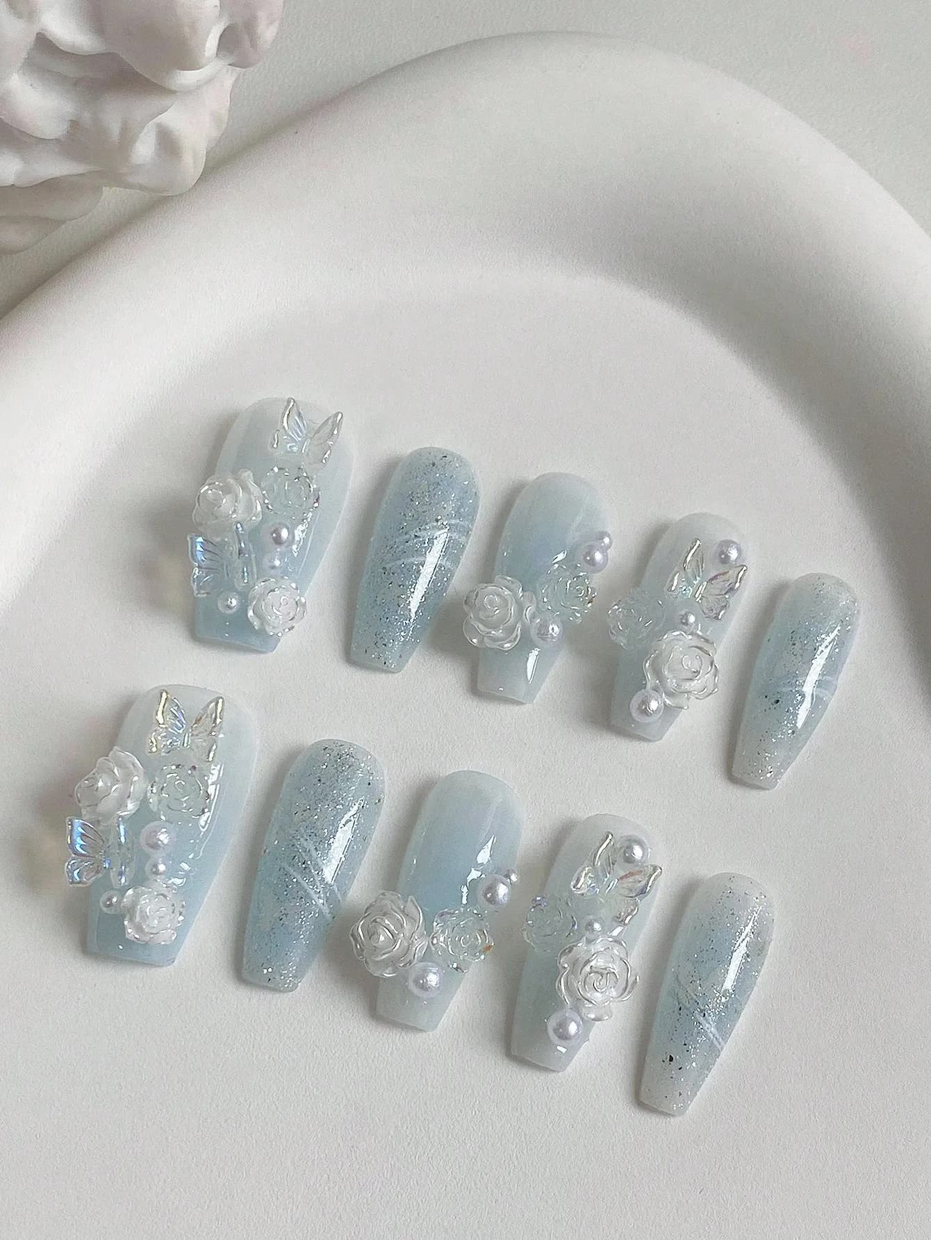10-Piece Long Coffin-Shaped Nails, Handmade in Light Blue with Ice-Transparent Design, Crystal Aurora, Butterfly, White Camellia, Pearl, and Rhinestone Accents, Pure and Gentle Style, Hand-Painted Lines, Nail Art Set Suitable for Parties, Balls, and Daily Wear, Removable and Reusable