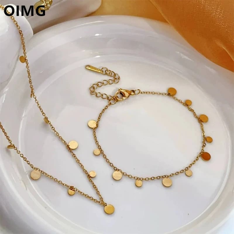 OIMG Set di gioielli in acciaio inossidabile placcato oro 316L Boho Collane con nappe rotonde Bracciale Cavigliera per donna Impermeabile