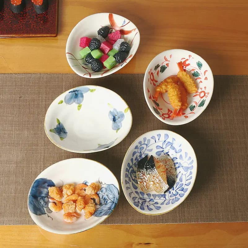 Ciotola da cucina giapponese di alta bellezza, ciotola per piatto freddo con piatto Yuanbao dipinto a mano, stoviglie irregolari per hotel, vassoio di frutta secca Dim Sum
