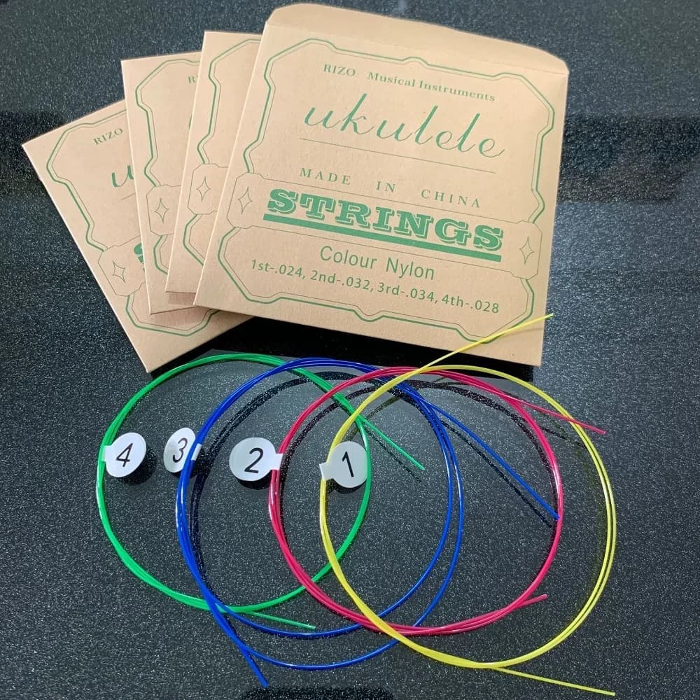 Set di corde per chitarra ukulele da 4 pezzi, corde in nylon colorate per ukulele da 21/23/26 pollici universale