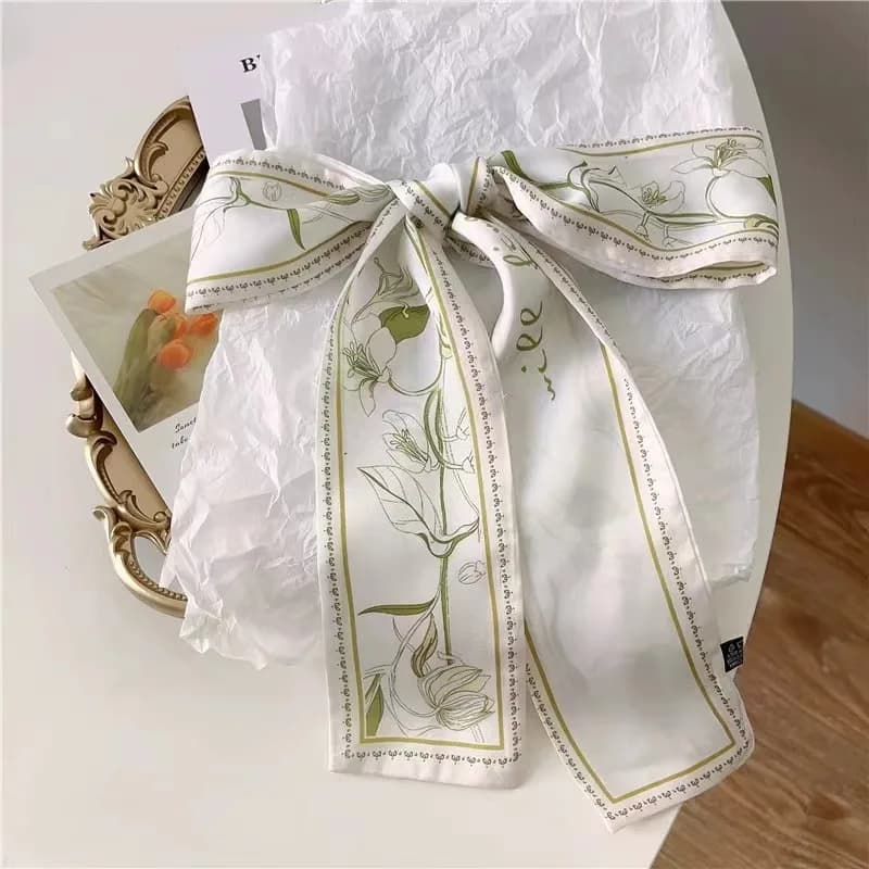 Delicate silk scarf with floral print Fashionable hair accessory for women Versatile long length tape