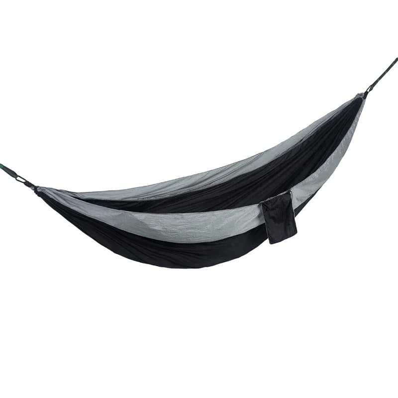 The outdoor equipment includes a tree, a hanging rocking chair with parachute to sleep. Trekking backpack for hammock