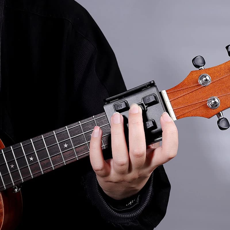 Strumento di attacco per l'apprendimento della pressa facile per l'aiuto per principianti dell'allenatore per accordi per ukulele