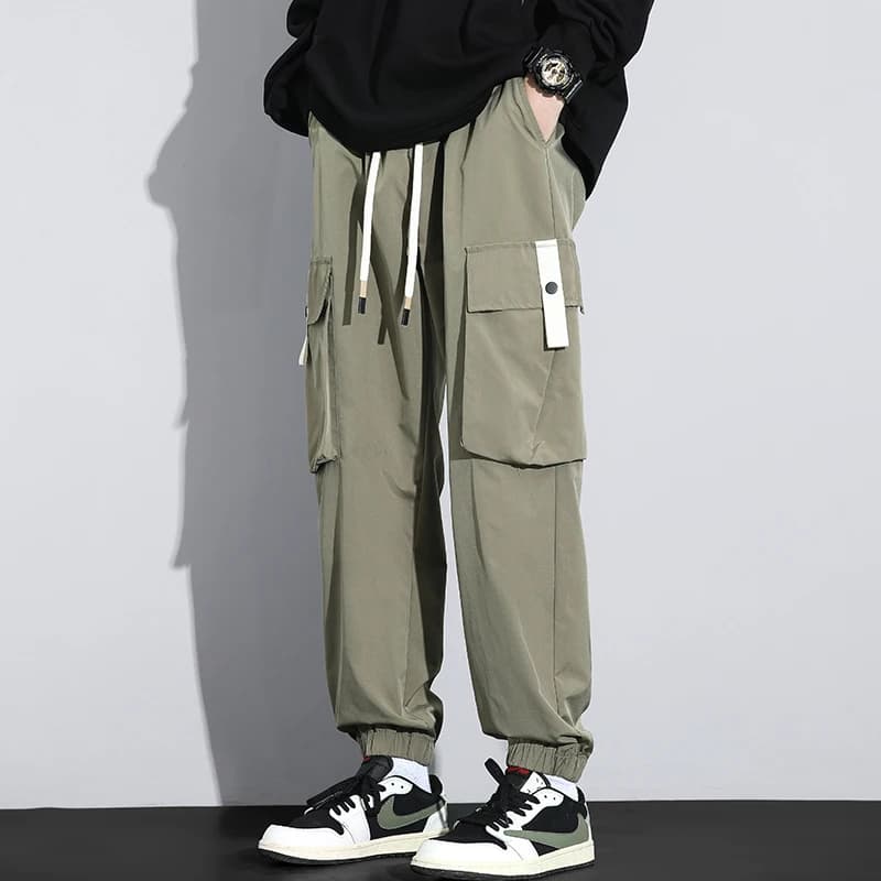 Primavera autunno uomo tinta unita tasche bottone elastico a vita alta fasciatura abbigliamento stile inghilterra Harem Bloomers pantaloni pantaloni