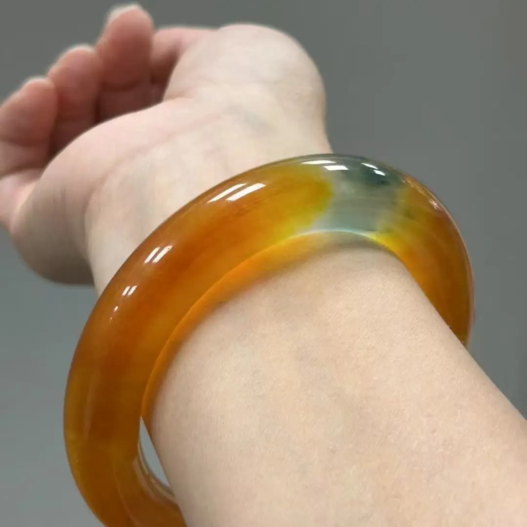 Elegant jadeite bracelet with ice seeds and thick round bar with yellow and dark blue floating flowers, refined jewelry