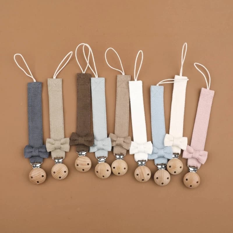 Catena per ciuccio con clip in legno e disegni con fiocco Clip per ciuccio colorata e per afferrare l'attenzione Porta giocattoli per la dentizione Essenziale