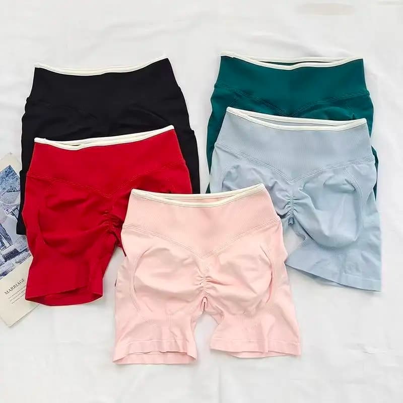 Pantaloncini da yoga sexy senza cuciture a blocchi di colore, pantaloni sportivi aderenti che sollevano i glutei, pantaloni da donna per corsa e fitness all'aperto